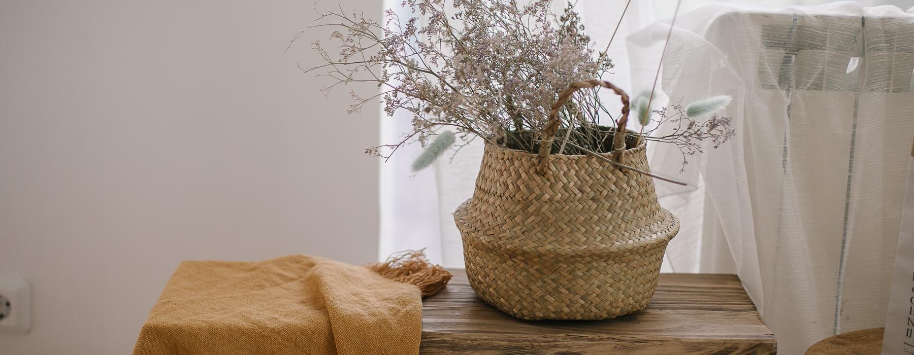 a basket with flowers on a table